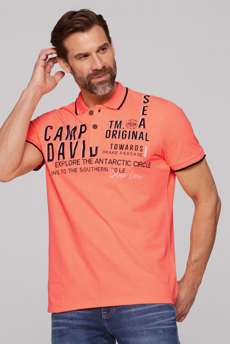 Kurzarmpolo aus Pikee mit Logo Artwork neon orange