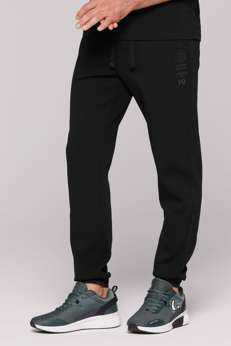 Trainingshose mit tonalen Pikee-Seitenstreifen black