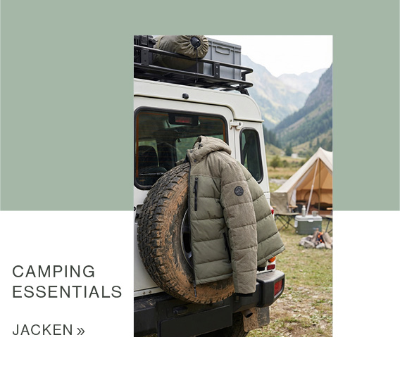 Camping Essentials, orange Steppjacke liegt auf dem Grund